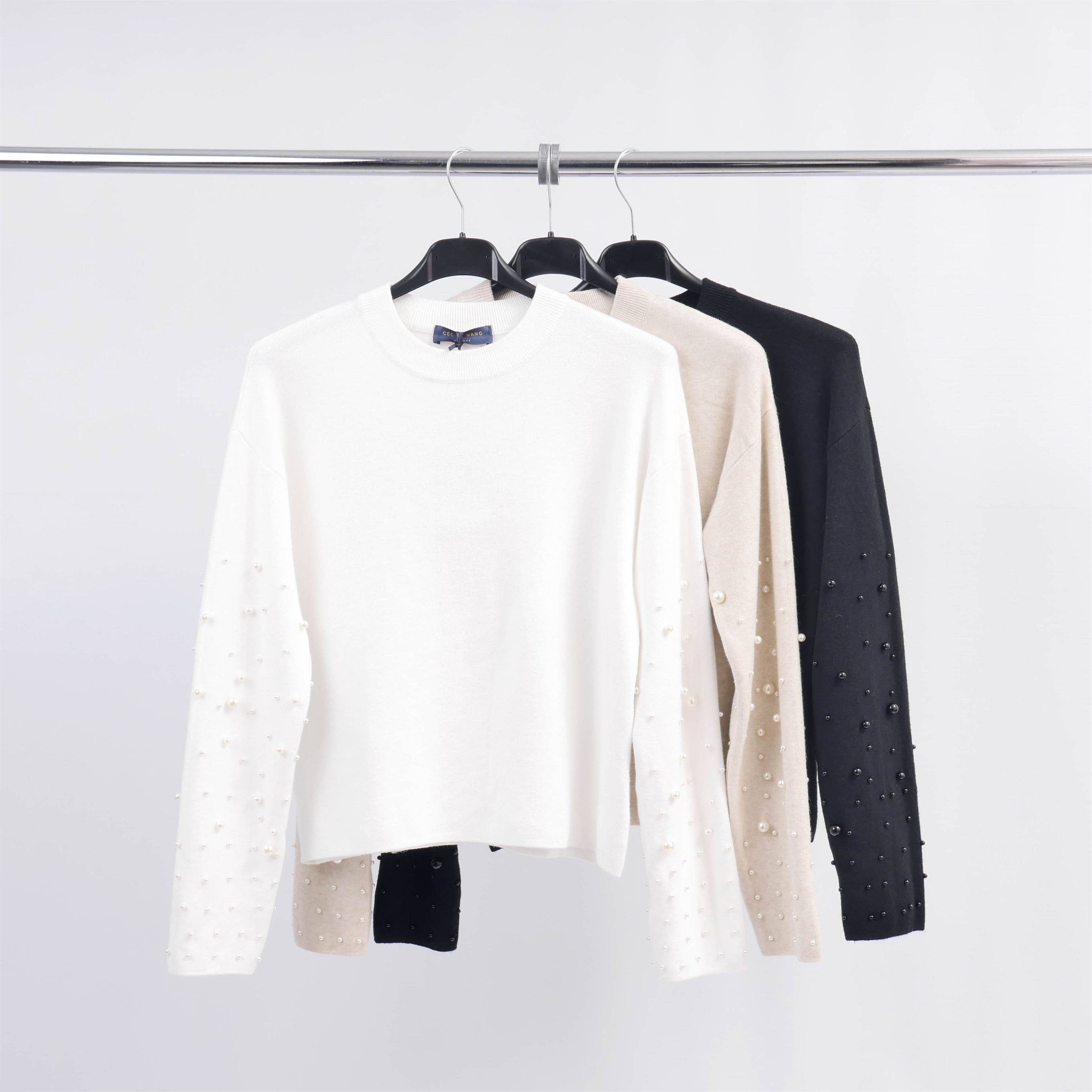 Pull col rond avec perles sur les manches DSY24226