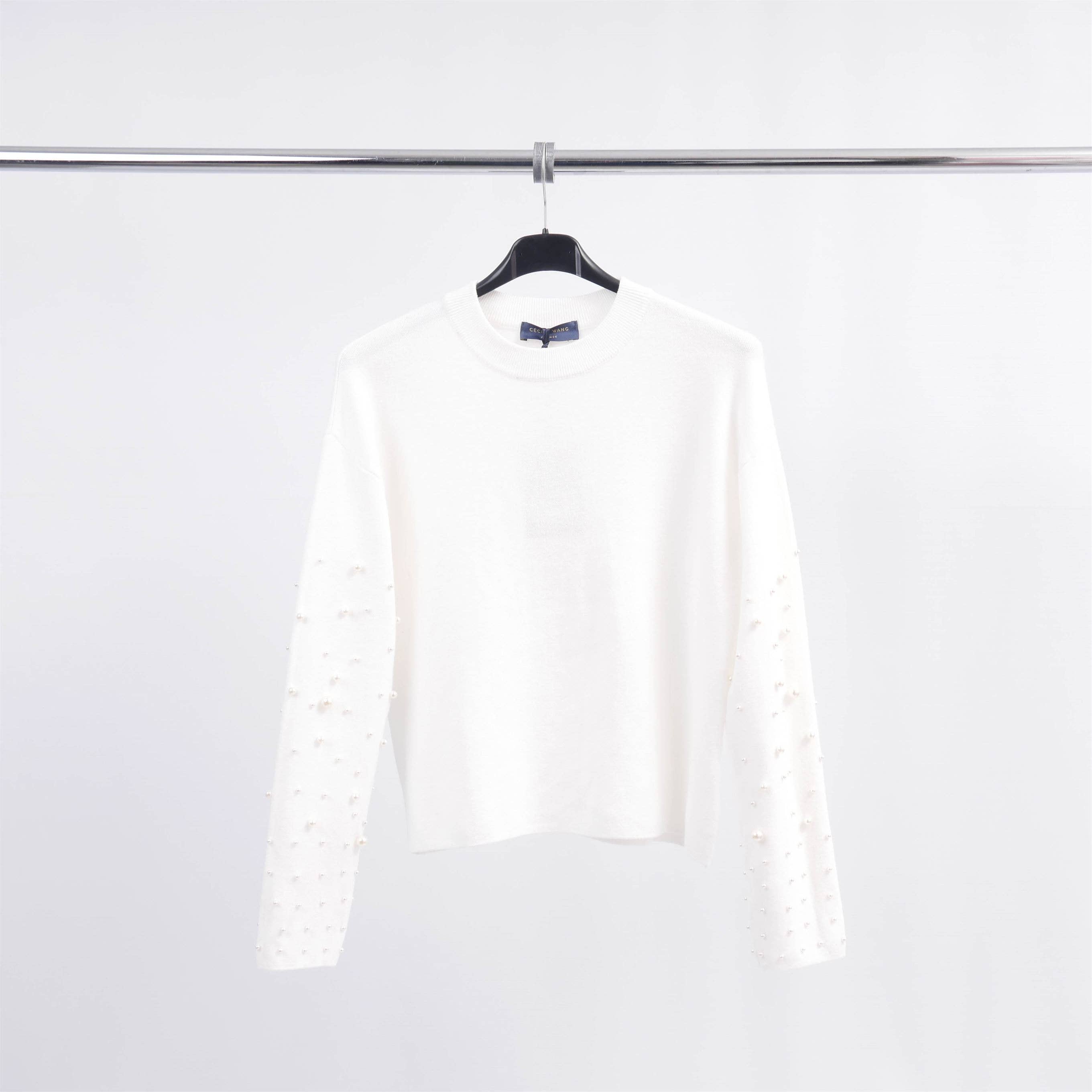 Pull col rond avec perles sur les manches DSY24226